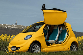 Yellow Softcar V1 reveal vehicle